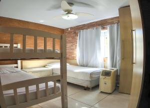 Ένα ή περισσότερα κρεβάτια σε δωμάτιο στο Moradas do Campeche CSABC