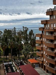 a view of the ocean from the balcony of a building at Apartamento Vacacional Oropesa del Mar primera línea in Oropesa del Mar