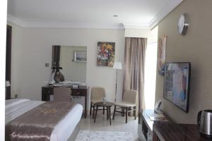 A bed or beds in a room at Tio Sea Resort