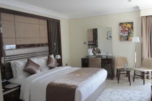 A bed or beds in a room at Tio Sea Resort