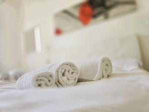Een bed of bedden in een kamer bij Relais Villa Olivi