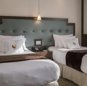 Postel nebo postele na pokoji v ubytování Aura Hotel Brooklyn