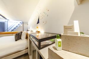Una cama o camas en una habitación de Hotel Carlota
