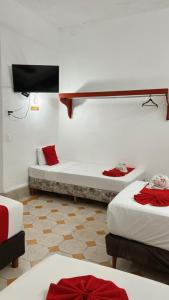 Postel nebo postele na pokoji v ubytování Hotel Margarita