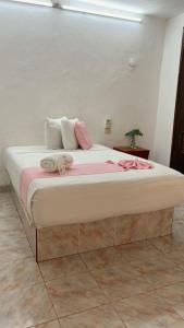 Postel nebo postele na pokoji v ubytování Hotel Margarita