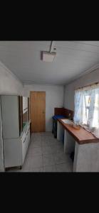 a small kitchen with a counter and a sink at Apartment in an excellent location in Colonia del Sacramento