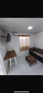 a living room with a table and a couch at Apartment in an excellent location in Colonia del Sacramento
