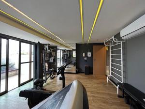 a room with a gym with a treadmill at (1406) Elegant Studio with Sea View in Vinhais
