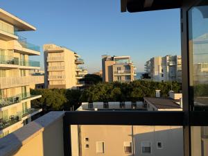a view of a city with tall buildings at Jesolo attic - beach spot in Lido di Jesolo