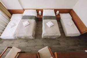 ATLAS Hotel Tatry客房内的一张或多张床位