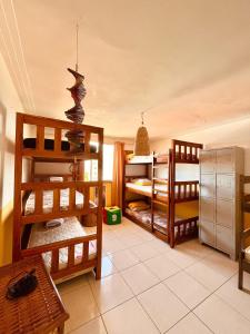 Ένα ή περισσότερα κρεβάτια σε δωμάτιο στο Casa Amarela Hostel & Bistrô - em Pituaçu