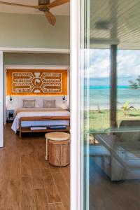 Postel nebo postele na pokoji v ubytování Niu Beach Hôtel Moorea