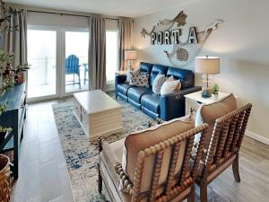 a living room with a couch and a table at Shore Thang in Port Aransas