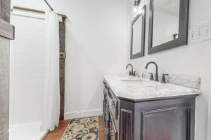 a bathroom with a sink and a mirror at The Tree House in Buxton +26 photos