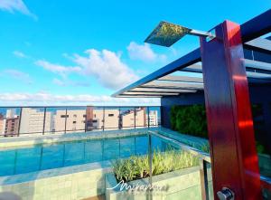 a swimming pool on the roof of a building at Emunah-Ponta de Campina Cabedelo in Cabedelo +44 photos