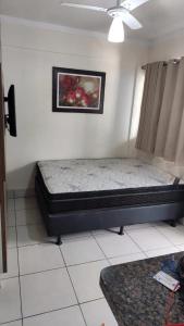 a bedroom with a bed in a room at Lacqua Diroma apartamento barato in Caldas Novas +13 photos