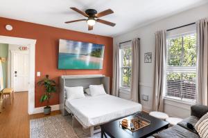 a bedroom with a bed and a ceiling fan at Updated 1 BR Home - Steps to 7th Ave in Tampa
