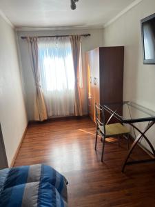 TV a/nebo společenská místnost v ubytování Hotel Plaza Los Leones