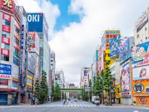 a street in a city with many signs at APA Hotel Akihabara Ekimae in Tokyo