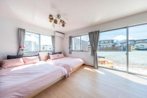 Postel nebo postele na pokoji v ubytování Private House Sora