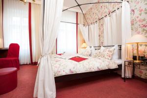 Postel nebo postele na pokoji v ubytování Boutique Hotel Kugel Wien