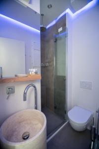 a bathroom with a shower and a sink and a toilet at Relais Luce Florence in Florence