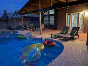 a swimming pool with beach balls in the water at Newly Remodeled Pool Villa-Fast WiFi -Summerlin in Las Vegas