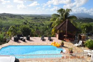 a swimming pool in a resort with a view at VillaPanoramic in Ducos