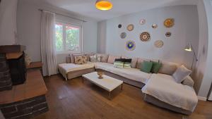 a living room with a couch and a table at Trip'n'Hostel Chill Zone in Tirana