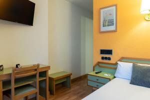TV a/nebo společenská místnost v ubytování Hotel Alda Guijuelo