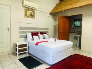 Ένα ή περισσότερα κρεβάτια σε δωμάτιο στο Richards Bay Airport Guest House The Comfort Zone