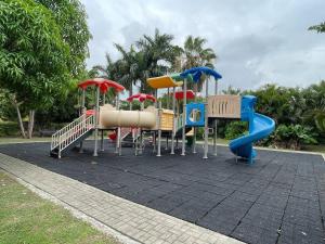 a playground with many different types of play equipment at Tropical 3 Bedroom Villa - Ocho Rios in Priory
