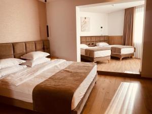 Postel nebo postele na pokoji v ubytování SIBB Hotel