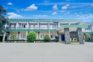 a building with a sign that reads rhodian hotel at Hotel O Bogor near Taman Safari formerly Hotel Rudian 1 in Bogor
