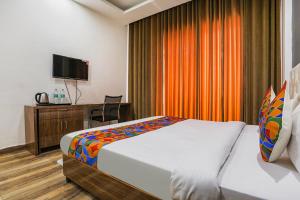 Postel nebo postele na pokoji v ubytování FabHotel Sky Rise Inn