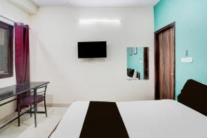 Μια τηλεόραση ή/και κέντρο ψυχαγωγίας στο Hotel O Shivam Residency +22 φωτογραφίες