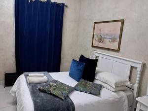 A bed or beds in a room at The Fountain Villa