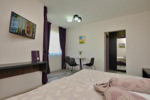 מיטה או מיטות בחדר ב-Apart Hotel Hello Hissar