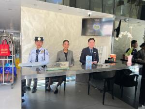 a group of three men sitting at a table at Condo Azure Urban Resort Paranaque in Manila +17 photos