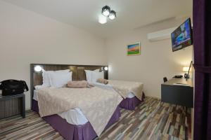 Voodi või voodid majutusasutuse Hotel Hello Hissar toas