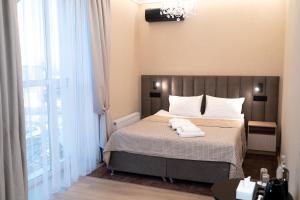 Postel nebo postele na pokoji v ubytování Hotel Palace Ukraine