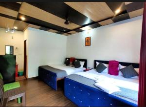 En eller flere senge i et værelse på Himalayan tourist cottage