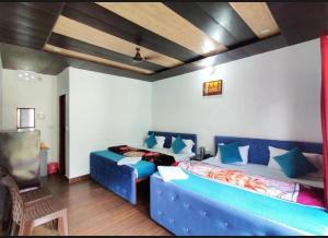 En eller flere senge i et værelse på Himalayan tourist cottage