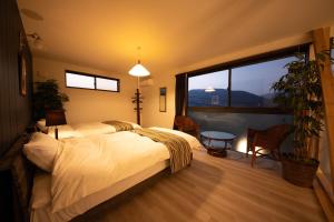 Postel nebo postele na pokoji v ubytování Gran Villa Rirera Towa