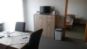 Μια τηλεόραση ή/και κέντρο ψυχαγωγίας στο Ferienwohnung Kottulinsky