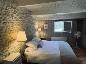 Postel nebo postele na pokoji v ubytování Petit lupin de l’estuaire