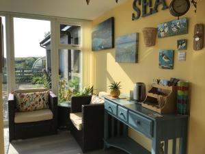 a room with a desk and chairs and a window at Old School B&B Super King Exclusive 5 Room private suite in Orkney