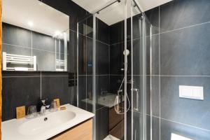a bathroom with a glass shower and a sink at Hostellerie du Petit Saint Bernard in Bourg-Saint-Maurice +63 photos