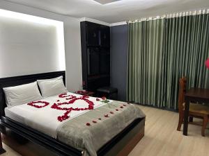 Postel nebo postele na pokoji v ubytování IÑAQUITO GOLD hostal