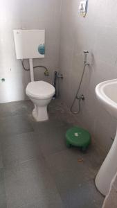 a bathroom with a toilet and a sink at Donmay homestay & guesthouse in Silapi
